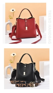 Close-up of leather bucket bags with gold buckles and printed wide shoulder straps