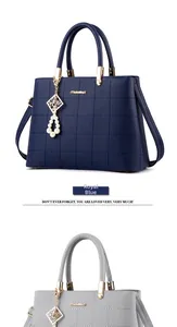 Quilted litchi leather handbags in royal blue and grey with pearl pendants and logo