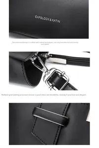 Detail of embossed logo, silver hardware and golden chain on black leather handbag