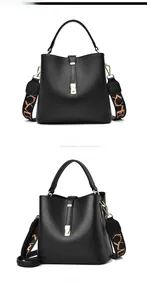 Front and side views of a black lychee leather bucket bag with an orange woven strap