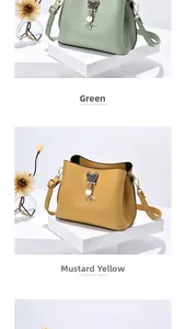 Green and ginger yellow bucket bags with chain charms and bear pendants on podiums