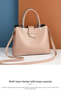 Detail view of pink crossbody bag showing multi-layer design and large capacity storage
