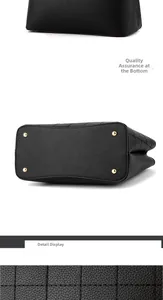 Detailed macro view of black lychee grain leather with quilted stitching and gold studs