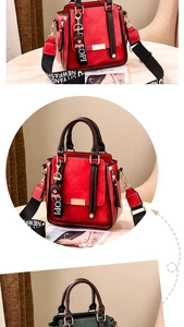 Detail of red faux leather tote bag with lychee texture and logo metal plate