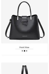 Front view of a black leather handbag with silver metallic clasp and trapezoidal silhouette