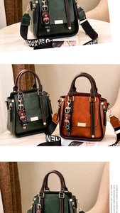 Detail of vintage PU leather handbag with wide woven strap and bear charm accessory