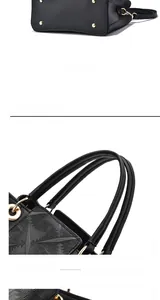 Detail einer schwarzen Ledertasche mit geometrischer Prägung und goldfarbenen Nieten