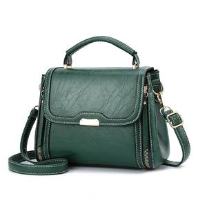Sac à main rétro vert foncé avec surpiqûres blanches contrastées et finitions dorées