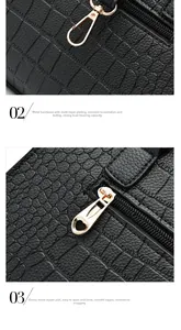 Detail of crocodile pattern leather bag with golden hooks and heart-shaped zipper pulls