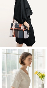 Chic geometric plaid tote bag styled with a trench coat for an elegant professional look