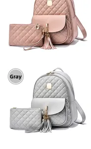 Détail des ensembles de sacs à dos matelassés avec pompons, coloris rose et gris inclus