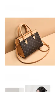 Detail view of brown monogram handbag with khaki trim and gold-tone hardware