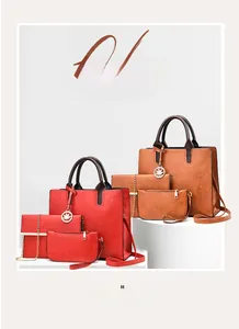 Detailansicht des 3-teiligen Handtaschen-Sets in Rot und Braun mit Ahornblatt-Anhänger