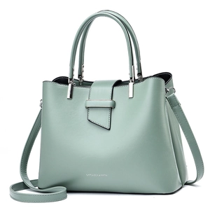 Minimalist mint green leather tote bag with top handles and adjustable shoulder strap
