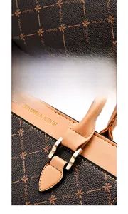 Detail showing the PLANEE&FASHION gold embossed logo on the brown leather handbag handle