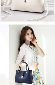 Detail of lychee pattern leather and gold twist lock on women's handbag with model styling