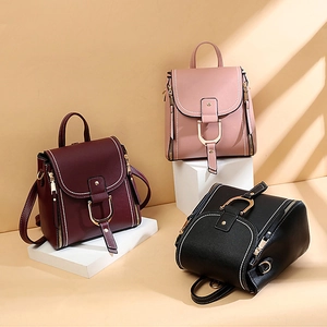 Stylish multi-color leather backpacks with metal D-buckles and vertical zipper details