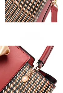 Detail of red synthetic leather bag with houndstooth pattern and pearl charm accessory