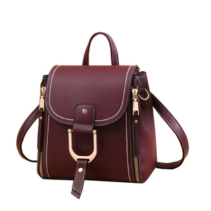 Versatile burgundy leather backpack for women with gold U-shaped hardware accents