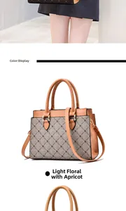 Detail view of apricot handbag with light floral pattern and adjustable strap
