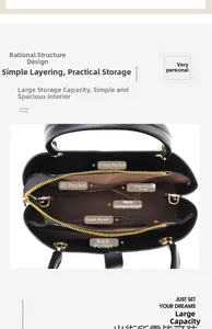 Top view showing the spacious interior of a black leather handbag with organized compartments