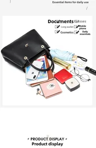 Top view of spacious black pebbled leather tote showing capacity for various daily items
