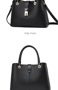 Close-up of black leather handbag featuring golden metal hardware and adjustable strap