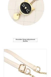 Detail of adjustable leather strap and cat-shaped metal charm on quilted bag