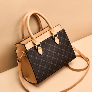 Women's floral tote bag with brown leather patchwork and adjustable strap in a 45-degree view