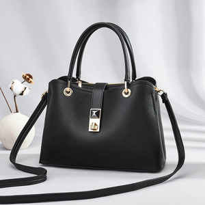 Classic black grained leather tote bag with gold hardware and adjustable strap