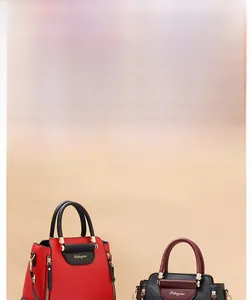 Detailed view of the color-block handbag showing high-quality leather and golden hardware