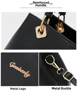Detail of reinforced handles and golden metal logo on the black leather wedding handbag