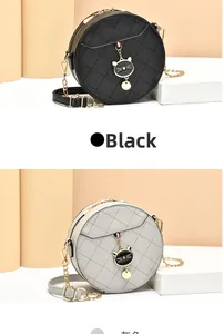 Close-up of quilted round crossbody bags with gold cat pendant and chain straps