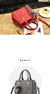 Detail of red and grey pebble leather handbags with V-shaped weave and plush pompom charm