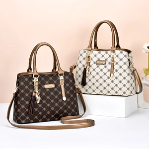 Elegant large capacity handbags with retro patterns and cat pendants for women