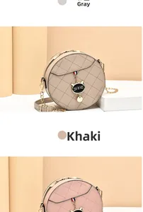 Detail of quilted leather mini round crossbody bags in grey and khaki with cat pendants