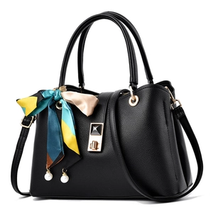 Elegant black lychee leather handbag with decorative scarf and pearl charms for women