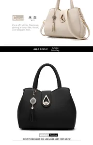 Detail view of lychee texture faux leather handbags with tassel charms in white and black