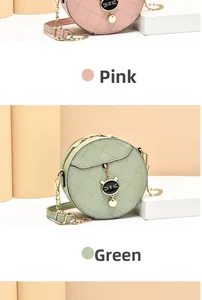 Detailed view of pink and green quilted cat-themed round chain crossbody bags