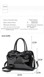Detailed size chart for black patent leather handbag with bow and crocodile texture