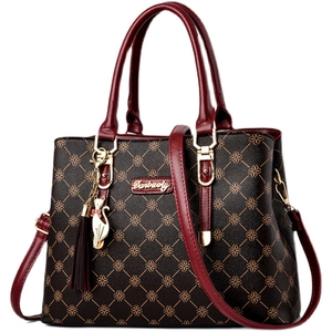 Women's chic clover print tote bag with wine red straps and elegant cat charm