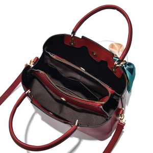 Fashionable burgundy textured faux leather tote bag with silk scarf and three compartments