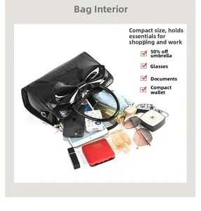 Detailed top view of crocodile pattern handbag showing spacious interior and daily essentials