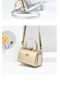 Detail of evening handbags with crocodile texture and rhinestone buckles in gold and silver