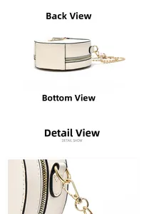 Detail view of cream round chain bag with black piping and gold hardware accents