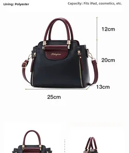 Detail view of large bicolor PU leather handbag with gold zipper and 25x20x13cm dimensions