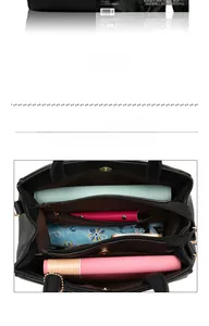 Top view of large capacity black tote interior showing multiple compartments and zip pockets