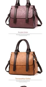 Detail view of purple and yellow textured leather handbags with dual handles and metal buckles
