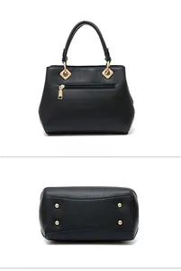Detail view of bridal handbag showing the back zip pocket and gold anti-wear studs on bottom