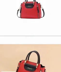 Detail view of red and black color-block PU leather handbag with gold chain strap